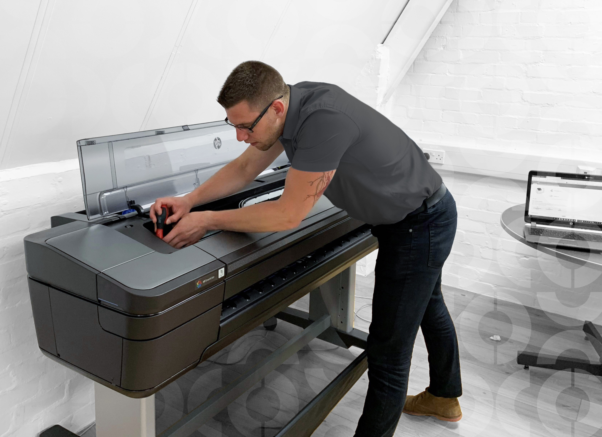 engineer servicing printer