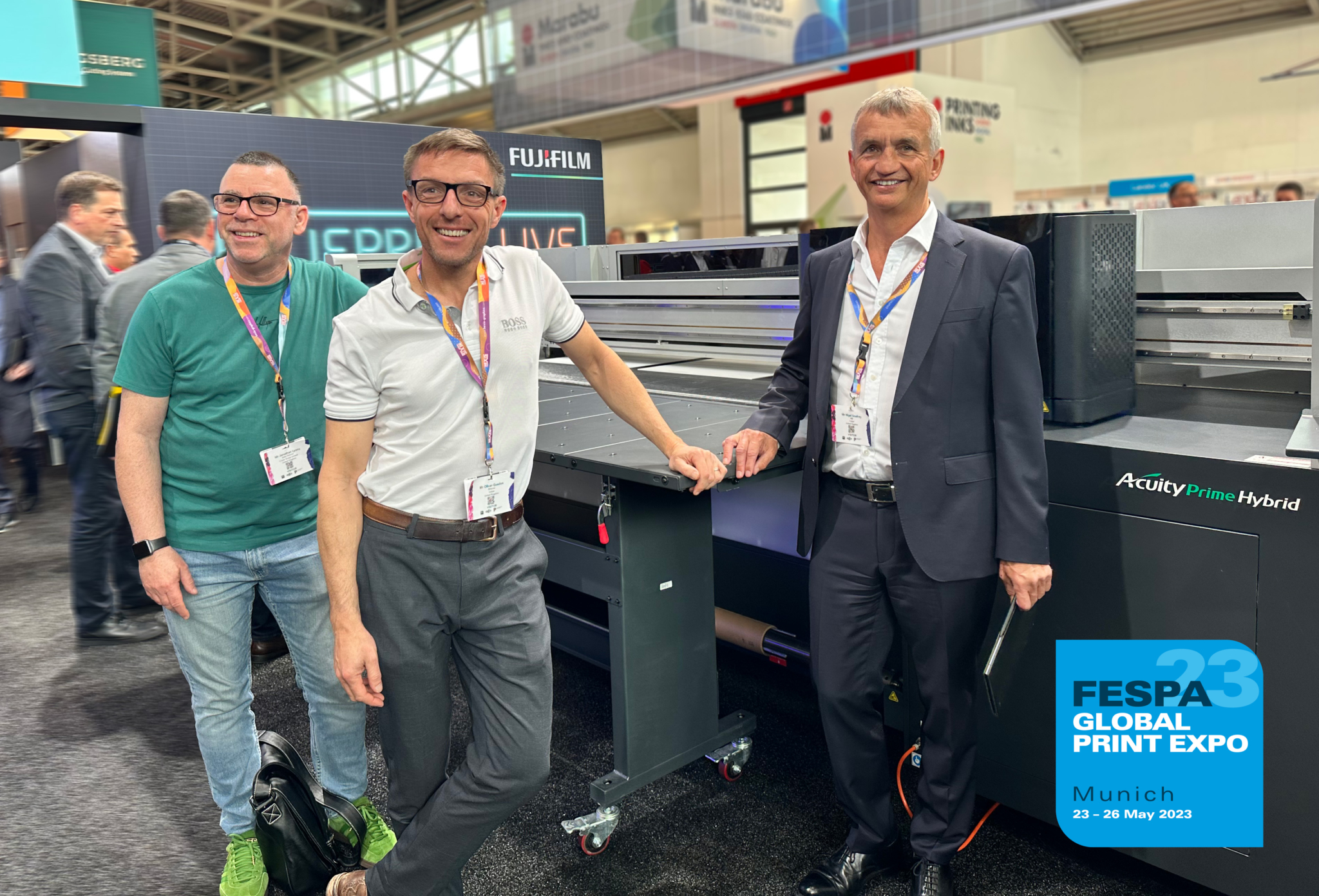 3 men in front of printer